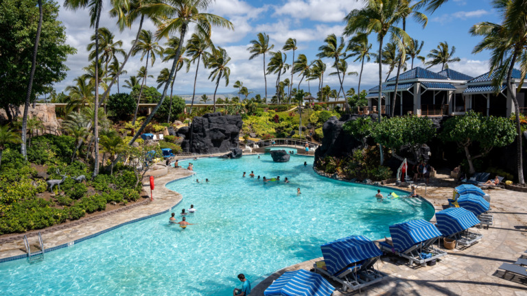Swimming pool and palm trees at Hilton Waikoloa Village in Hawaii, archive photograph from 2023