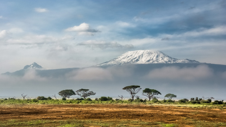 The snow-covered summit of Kilimanjaro in Tanzania, seen from Amboseli in Kenya